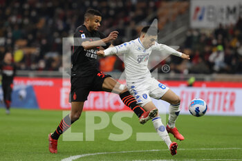 2022-03-12 - Junior Messias of AC Milan competes for the ball with Fabiano Parisi of Empoli FC during the Serie A 2021/22 football match between AC Milan and Empoli FC at Giuseppe Meazza Stadium, Milan, Italy on March 12, 2022 - AC MILAN VS EMPOLI FC - ITALIAN SERIE A - SOCCER