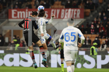 2022-03-12 - Zlatan Ibrahimovic of AC Milan competes for the ball with Sebastiano Luperto of Empoli FC during the Serie A 2021/22 football match between AC Milan and Empoli FC at Giuseppe Meazza Stadium, Milan, Italy on March 12, 2022 - AC MILAN VS EMPOLI FC - ITALIAN SERIE A - SOCCER