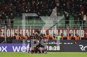 2022-03-12 - Pierre Kalulu of AC Milan celebrates with his team mates after scoring a goal during the Serie A 2021/22 football match between AC Milan and Empoli FC at Giuseppe Meazza Stadium, Milan, Italy on March 12, 2022 - AC MILAN VS EMPOLI FC - ITALIAN SERIE A - SOCCER