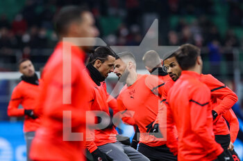 2022-03-12 - Zlatan Ibrahimovic of AC Milan and Olivier Giroud of AC Milan warm up during the Serie A 2021/22 football match between AC Milan and Empoli FC at Giuseppe Meazza Stadium, Milan, Italy on March 12, 2022 - AC MILAN VS EMPOLI FC - ITALIAN SERIE A - SOCCER