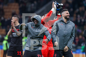 2022-03-12 - Franck Kessie of AC Milan and Olivier Giroud of AC Milan celebrate the victory at the end of the match during the Serie A 2021/22 football match between AC Milan and Empoli FC at Giuseppe Meazza Stadium, Milan, Italy on March 12, 2022 - AC MILAN VS EMPOLI FC - ITALIAN SERIE A - SOCCER