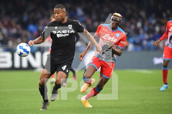 2022-03-19 - Marvin Zeegelaar ( Udinese Calcio) and Victor Osimhen (SSC Napoli) They compete for the ball during the Serie A 2021/22 match between SSC. Napoli and Udinese Calcio at Diego Armando Maradona Stadium, Italy March 19,2022 - SSC NAPOLI VS UDINESE CALCIO - ITALIAN SERIE A - SOCCER