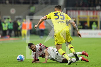 2022-04-04 - Junior Messias of AC Milan competes for the ball with Mitchell Dijks of Bologna FC during the Serie A 2021/22 football match between AC Milan and Bologna FC at Giuseppe Meazza Stadium, Milan, Italy on April 04, 2022 - AC MILAN VS BOLOGNA FC - ITALIAN SERIE A - SOCCER
