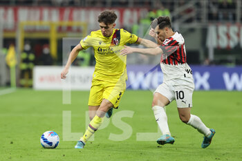 2022-04-04 - Aaron Hickey of Bologna FC competes for the ball with Brahim Diaz of AC Milan during the Serie A 2021/22 football match between AC Milan and Bologna FC at Giuseppe Meazza Stadium, Milan, Italy on April 04, 2022 - AC MILAN VS BOLOGNA FC - ITALIAN SERIE A - SOCCER