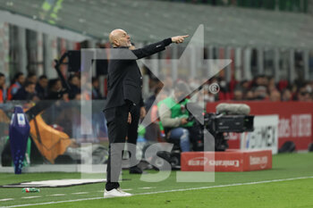2022-04-04 - Stefano Pioli Head Coach of AC Milan reacts from the bench during the Serie A 2021/22 football match between AC Milan and Bologna FC at Giuseppe Meazza Stadium, Milan, Italy on April 04, 2022 - AC MILAN VS BOLOGNA FC - ITALIAN SERIE A - SOCCER