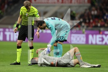2022-04-15 - Milan Badelj of Genoa CFC injured during the Serie A 2021/22 football match between AC Milan and Genoa CFC at Giuseppe Meazza Stadium, Milan, Italy on April 15, 2022 - AC MILAN VS GENOA CFC - ITALIAN SERIE A - SOCCER
