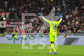 2022-04-15 - Mike Maignan of AC Milan reacts during the Serie A 2021/22 football match between AC Milan and Genoa CFC at Giuseppe Meazza Stadium, Milan, Italy on April 15, 2022 - AC MILAN VS GENOA CFC - ITALIAN SERIE A - SOCCER