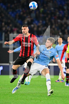 2022-04-24 - Rade Krunic (AC Milan) Toma Basic (SS Lazio) during the Italian Football Championship League A 2021/2022 match between SS Lazio vs AC Milan at the Olimpic Stadium in Rome on 24 April 2022. - SS LAZIO VS AC MILAN - ITALIAN SERIE A - SOCCER