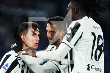 2022-01-09 - Paulo Dybala of Juventus (L) celebrates with Rodrigo Bentancur (C) and Moise Kean (R) after scoring 1-1 goal during the Italian championship Serie A football match between AS Roma and Juventus FC on January 9, 2022 at Stadio Olimpico in Rome, Italy - AS ROMA VS JUVENTUS FC - ITALIAN SERIE A - SOCCER