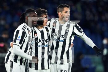 2022-01-09 - Paulo Dybala of Juventus (C) celebrates with Rodrigo Bentancur (R) and Moise Kean (L) after scoring 1-1 goal during the Italian championship Serie A football match between AS Roma and Juventus FC on January 9, 2022 at Stadio Olimpico in Rome, Italy - AS ROMA VS JUVENTUS FC - ITALIAN SERIE A - SOCCER