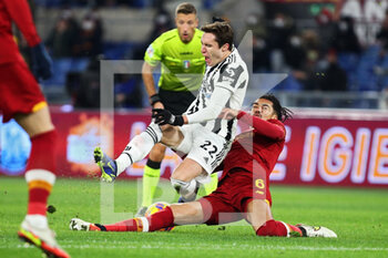 2022-01-09 - Federico Chiesa of Juventus (L) falls injured after a tackle by Chris Smalling of Roma (R) during the Italian championship Serie A football match between AS Roma and Juventus FC on January 9, 2022 at Stadio Olimpico in Rome, Italy - AS ROMA VS JUVENTUS FC - ITALIAN SERIE A - SOCCER