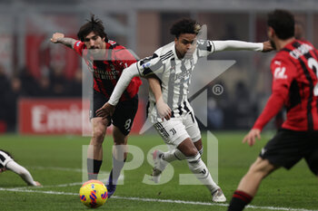 2022-01-23 - Sandro Tonali (AC Milan) and Weston Mckennie (Juventus FC) battle for the ball  - AC MILAN VS JUVENTUS FC - ITALIAN SERIE A - SOCCER