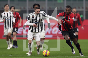 2022-01-23 - Rafael Leao (AC Milan) and Mattia De Sciglio (Juventus FC) battle for the ball  - AC MILAN VS JUVENTUS FC - ITALIAN SERIE A - SOCCER