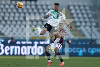 2022-01-23 - Gianluca Scamacca (U.S. Sassuolo) and Gleison Bremer (Torino FC) battle for the ball  - TORINO FC VS US SASSUOLO - ITALIAN SERIE A - SOCCER