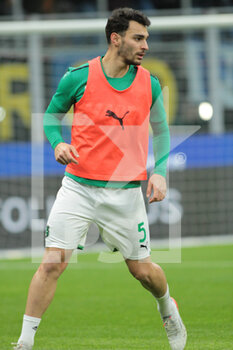 2022-02-20 - Kaan Ayhan of US Sassuolo during the Italian Serie A football match between FC Inter and Sassuolo Calcio on February 20, 2022 at San Siro - Giuseppe Meazza stadium in Milano , Italy - INTER - FC INTERNAZIONALE VS US SASSUOLO - ITALIAN SERIE A - SOCCER