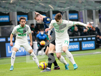 2022-02-20 - Georgios Kyriakopoulos of US Sassuolo and Milan Skrinar of Inter  during the Italian Serie A football match between FC Inter and Sassuolo Calcio on February 20, 2022 at San Siro - Giuseppe Meazza stadium in Milano , Italy - INTER - FC INTERNAZIONALE VS US SASSUOLO - ITALIAN SERIE A - SOCCER