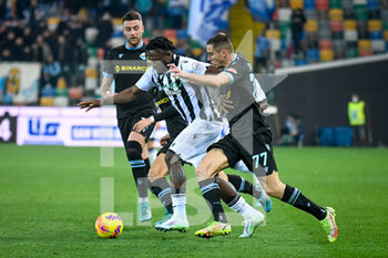 2022-02-20 - Udinese's Isaac Success in action hindered by Lazio's Adam Marusic and Lazio's Sergej Milinković-Savić - UDINESE CALCIO VS SS LAZIO - ITALIAN SERIE A - SOCCER