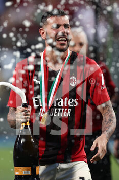 2022-05-22 - Theo Hernandez (AC Milan) celebrates with a bottle of champagne - US SASSUOLO VS AC MILAN - ITALIAN SERIE A - SOCCER