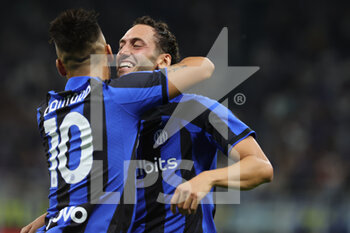 2022-08-20 - Hakan Calhanoglu of FC Internazionale celebrates after scoring a goal with Lautaro Martinez of FC Internazionale during the Serie A 2022/23 football match between FC Internazionale and Spezia Calcio at Giuseppe Meazza Stadium, Milan, Italy on August 20, 2022 - INTER - FC INTERNAZIONALE VS SPEZIA CALCIO - ITALIAN SERIE A - SOCCER