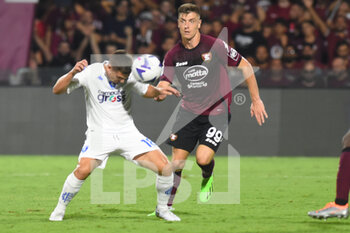2022-09-05 - Krzysztof Piatek of US Salernitana and Razvan Marin of Empoli FC   competes for the ball with during the Serie A match between US Salernitana 1919 and FC Empoli  at Stadio Arechi   - US SALERNITANA VS EMPOLI FC - ITALIAN SERIE A - SOCCER