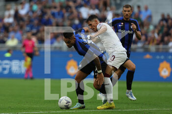 2022-09-10 - Lautaro Martinez of FC Internazionale competes for the ball with Sasa Lukic of Torino FC during the Serie A 2022/23 football match between FC Internazionale and Torino FC at Giuseppe Meazza Stadium, Milan, Italy on September 10, 2022 - INTER - FC INTERNAZIONALE VS TORINO FC - ITALIAN SERIE A - SOCCER
