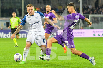 2022-10-10 - Lazio's Ciro Immobile hampered by Fiorentina's Rolando Mandragora - ACF FIORENTINA VS SS LAZIO - ITALIAN SERIE A - SOCCER