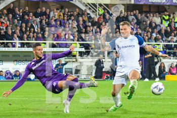 2022-10-10 - Fiorentina's Rolando Mandragora fights for the ball against Lazio's Ciro Immobile - ACF FIORENTINA VS SS LAZIO - ITALIAN SERIE A - SOCCER