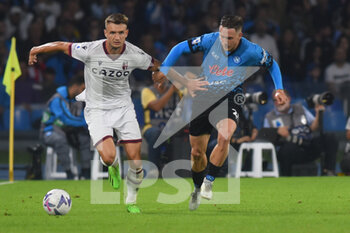 2022-10-16 - Piotr Zielinski of SSC Napoli  and Stefan Posch of Bologna FC  competes for the ball with  during the Serie A match between US Salernitana 1919 and Hellas Verona FC  at Stadio Arechi   - SSC NAPOLI VS BOLOGNA FC - ITALIAN SERIE A - SOCCER