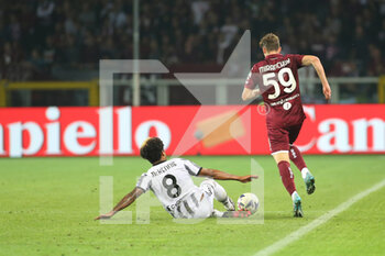 2022-10-15 - Weston McKennie (Juventus FC) slips in on Alexey Miranchuk (Torino FC) - TORINO FC VS JUVENTUS FC - ITALIAN SERIE A - SOCCER
