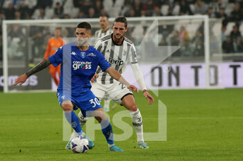 2022-10-21 - Petar Stojanovic (FC Empoli) vs Adrien Rabiot (Juventus FC) - JUVENTUS FC VS EMPOLI FC - ITALIAN SERIE A - SOCCER