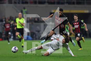 2022-11-05 - Junior Messias of AC Milan competes for the ball with Ethan Ampadu of Spezia Calcio during Serie A 2022/23 football match between AC Milan and Spezia Calcio at Giuseppe Meazza Stadium, Milan, Italy on November 05, 2022 - AC MILAN VS SPEZIA CALCIO - ITALIAN SERIE A - SOCCER