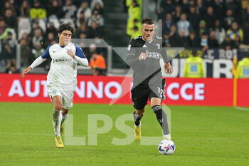 2022-11-13 - Filip Kostic (Juventus FC) in action against Luka Romero (SS Lazio) - JUVENTUS FC VS SS LAZIO - ITALIAN SERIE A - SOCCER