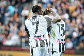 2022-10-23 - Udinese's Isaac Success and Udinese's Destiny Iyenoma Udogie celebrates after Udinese's Gerard Deulofeu scored a goal - UDINESE CALCIO VS TORINO FC - ITALIAN SERIE A - SOCCER