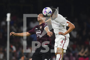 2022-08-14 - Bryan Cristante ( AS. Roma) and Federico Bonazzoli( US. Salernitana 1919) competes for the ball with during the Serie A 2022/23 match between US Salernitana1919 and AS Roma  Arechi  Stadium - US SALERNITANA VS AS ROMA - ITALIAN SERIE A - SOCCER