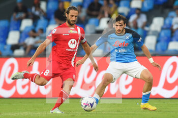 2022-08-21 - Khvicha Kvaratskhelia (SSC Napoli) and Andrea Barberis  ( AC Monza) competes for the ball with during the Serie A 2022/23 match between SSC Napoli And AC Monza Diego Armando Maradona Stadium - SSC NAPOLI VS AC MONZA - ITALIAN SERIE A - SOCCER
