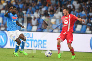 2022-08-21 - Christian Gytkjær  ( AC Monza) and André-Frank Zambo Anguissa (SSC Napoli) competes for the ball with during the Serie A 2022/23 match between SSC Napoli And AC Monza Diego Armando Maradona Stadium - SSC NAPOLI VS AC MONZA - ITALIAN SERIE A - SOCCER