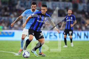 2022-08-26 - Lautaro Martinez of Internazionale (R) vies for the ball with Danilo Cataldi of Lazio (L) during the Italian championship Serie A football match between SS Lazio and FC Internazionale on August 26, 2022 at Stadio Olimpico in Rome, Italy - FOOTBALL - ITALIAN CHAMP - LAZIO V INTERNAZIONALE - ITALIAN SERIE A - SOCCER