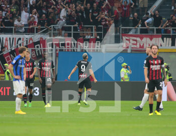 2022-09-03 - Oliver Giroud of Ac Milan celebrating with supporters after a goal during the Italian Serie A tootball match between Ac Milan and Fc Inter on 03 of September 2022 at Giuseppe Meazza _ San Siro Siro stadium in Milan, Italy. Photo Nderim Kaceli - AC MILAN VS INTER - FC INTERNAZIONALE - ITALIAN SERIE A - SOCCER