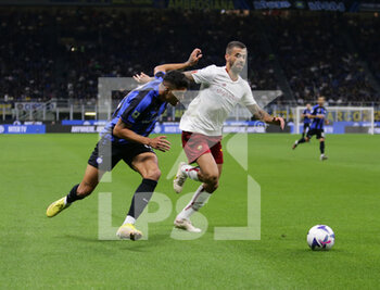 2022-10-01 - Raoul Bellanova of Fc Inter and Leonardo Spinazzola of As Roma during the Italian Serie A, Football match between Fc Inter and As Roma on October 1, 2022 at San Siro Stadium, Milan, Italy. Photo Nderim Kaceli - INTER - FC INTERNAZIONALE VS AS ROMA - ITALIAN SERIE A - SOCCER