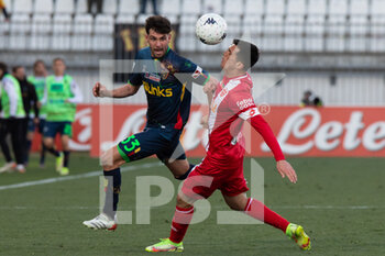 2022-02-27 - Arturo Calabresi and Salvatote Molina fight for the ball during the Serie B match between Monza and Lecce at U Power Stadium on February 27, 2022 in Monza, Italy. - AC MONZA VS US LECCE - ITALIAN SERIE B - SOCCER