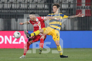 2022-03-02 - Enrico Delprato of PARMA CALCIO competes for the ball with Dany Mota Carvalho of AC MONZA during the Serie B match between AC Monza and Parma Calcio at U-Power Stadium on March 2, 2022 in Monza, Italy. - AC MONZA VS PARMA CALCIO - ITALIAN SERIE B - SOCCER