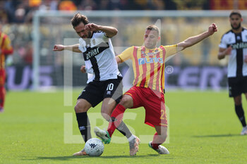 2022-03-19 - Franco Vazquez of PARMA CALCIO competes for the ball with Alexis Blin of US LECCE during the Serie B match between Parma Calcio and US Lecce at Ennio Tardini on March 19, 2022 in Parma, Italy. - PARMA CALCIO VS US LECCE - ITALIAN SERIE B - SOCCER