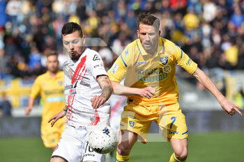2022-04-09 - FROSINONE, ITALY -  March 9 : Gianluca Gaetano (L) of  Cremonese in action against   Marcus Christer Roheden   (R) of Frosinone during the  Serie B  soccer match between  Frosinone and Cremonese Stadio Benito Stirpe on March 9,2022 in Frosinone Italy  - FROSINONE CALCIO VS US CREMONESE - ITALIAN SERIE B - SOCCER