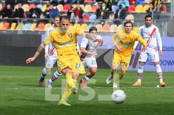 2022-04-09 - FROSINONE, ITALY - March 9 : Luigi Canotto (27)  of Frosinone  celebrates  scores  the penalty  during    soccer match between  Frosinone  and Cremonese at Stadio Benito Stirpe on March 9,2022  in Frosinone Italy - FROSINONE CALCIO VS US CREMONESE - ITALIAN SERIE B - SOCCER
