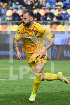 2022-04-09 - FROSINONE, ITALY - March 9 : Luigi Canotto (27)  of Frosinone  celebrates  scores  the penalty  during    soccer match between  Frosinone  and Cremonese at Stadio Benito Stirpe on March 9,2022  in Frosinone Italy - FROSINONE CALCIO VS US CREMONESE - ITALIAN SERIE B - SOCCER