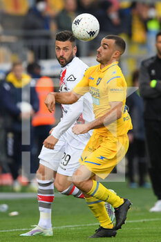 2022-04-09 - FROSINONE, ITALY -  March 9 : Samuel Di Carmine (L) of  Cremonese in action against   Matteo Cotali  (R) of Frosinone during the  Serie B  soccer match between  Frosinone and Cremonese Stadio Benito Stirpe on March 9,2022 in Frosinone Italy  - FROSINONE CALCIO VS US CREMONESE - ITALIAN SERIE B - SOCCER