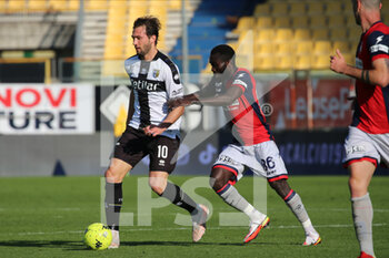 2022-01-30 - Franco Vazquez of PARMA CALCIO competes for the ball with Theophilus Awua of CROTONE FC during the Serie B match between Parma Calcio and Crotone FC at Ennio Tardini on January 30, 2022 in Parma, Italy. - PARMA CALCIO VS FC CROTONE - ITALIAN SERIE B - SOCCER