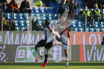 2022-01-30 - Ange-Yoan Laurent Bonny of PARMA CALCIO competes for the ball with Ionut Nedelcearu during the Serie B match between Parma Calcio and Crotone FC at Ennio Tardini on January 30, 2022 in Parma, Italy. - PARMA CALCIO VS FC CROTONE - ITALIAN SERIE B - SOCCER