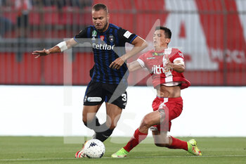 2022-05-26 - Salvatore Molina (AC Monza) and \pis31\ battle for the ball George Puscas (AC Pisa 1909) - PLAY OFF - AC MONZA VS AC PISA - ITALIAN SERIE B - SOCCER