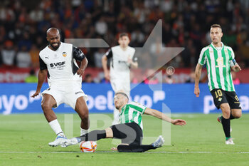 2022-04-23 - Guido Rodriguez of Real Betis and Dimitri Foulquier of Valencia during the Spanish Cup, Copa del Rey, Final football match between Real Betis Balompie and Valencia CF on April 23, 2022 at Estadio de la Cartuja in Sevilla, Spain - FINAL - REAL BETIS BALOMPIE VS VALENCIA CF - SPANISH CUP - SOCCER